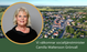 drönarbild över Grästorps kommun i bakgrunden med ett porträtt av socialtjänsministern i förgrunden.